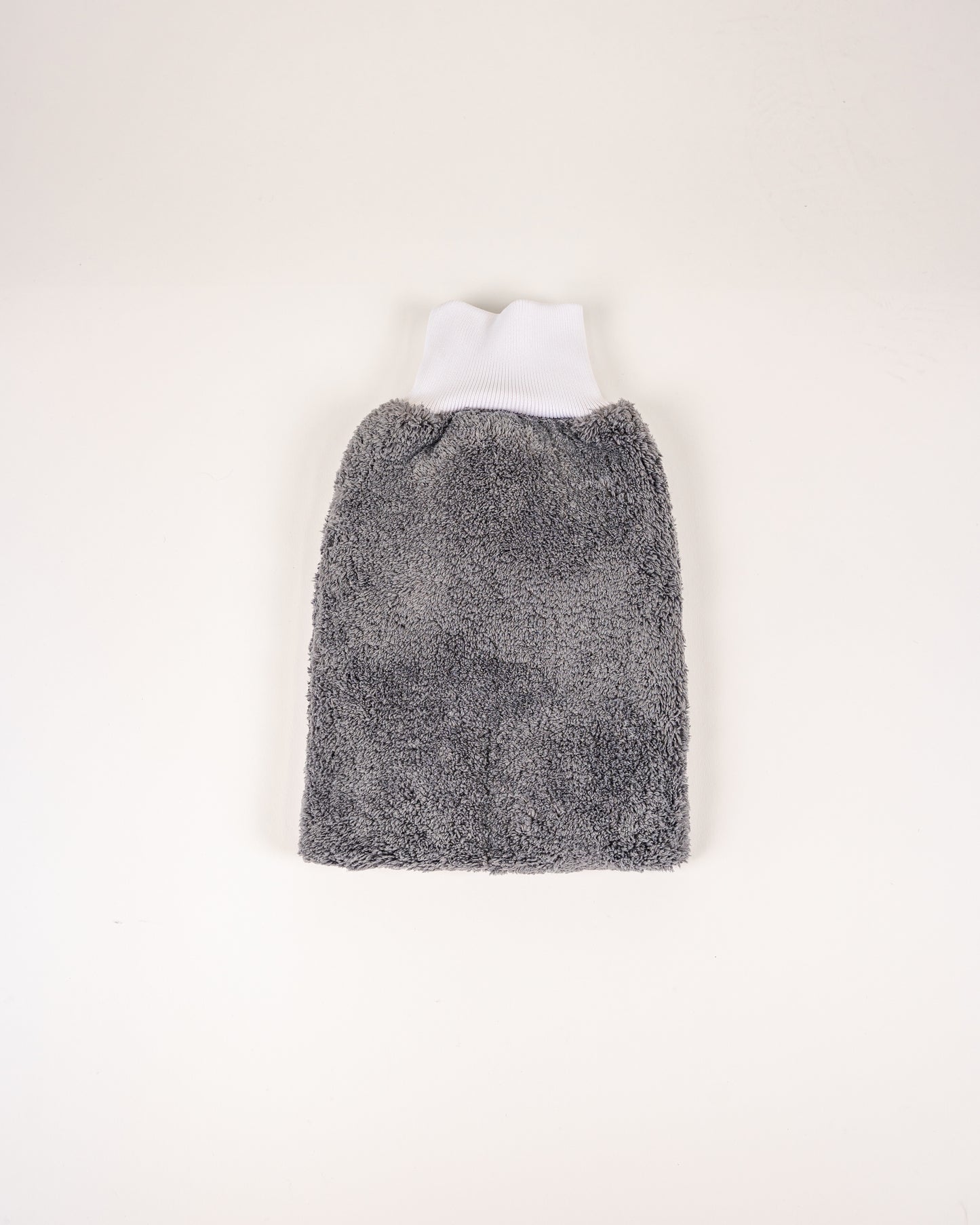 The FibreKing PS Korean Microfibre Mitt in grey, featuring an ultra-soft texture and white ribbed opening, is shown lying flat on a plain white background.