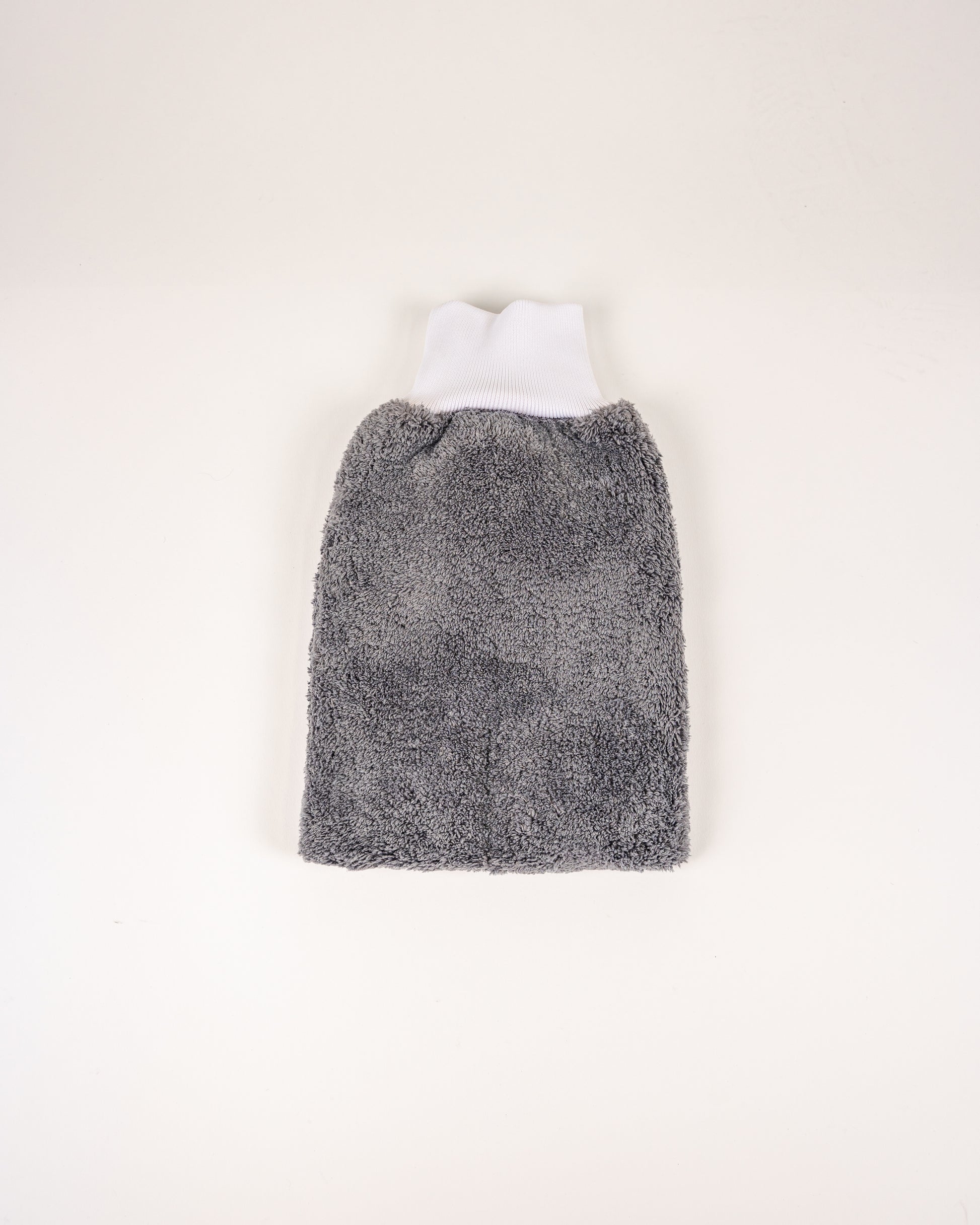 The FibreKing PS Korean Microfibre Mitt in grey, featuring an ultra-soft texture and white ribbed opening, is shown lying flat on a plain white background.