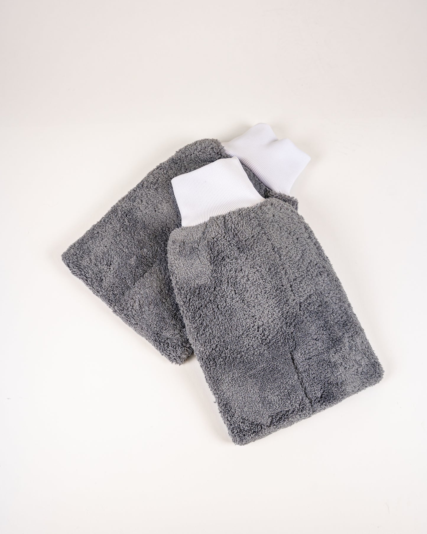 The FibreKing PS Korean Microfibre Mitts—gray, rectangular, and ultra-soft with white elastic cuffs—are ideal for scratch-free car washes.