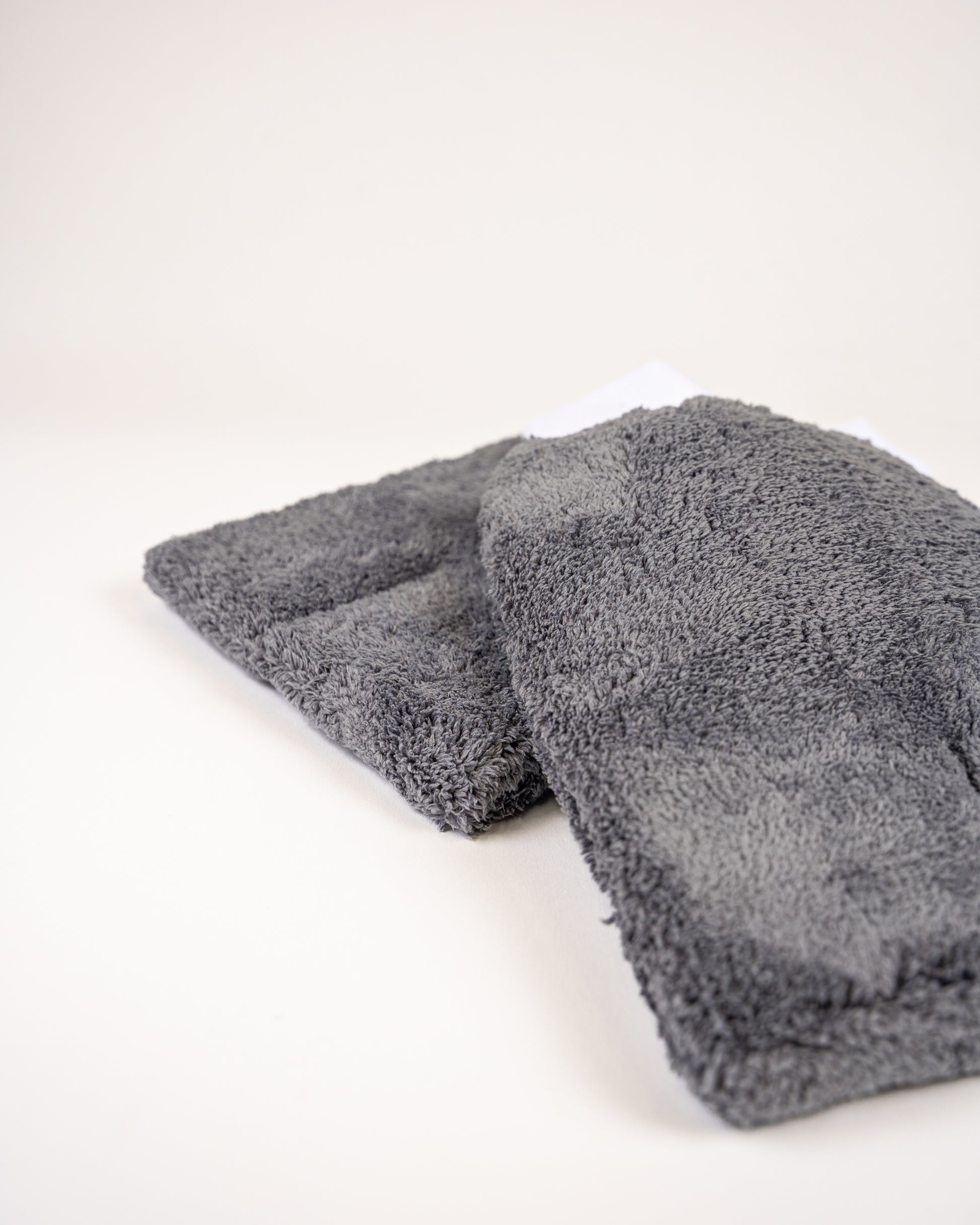 The FibreKing PS Korean Microfibre Mitt in grey is shown stacked on a plain background, highlighting its ultra-soft texture for gentle cleaning and scratch prevention.