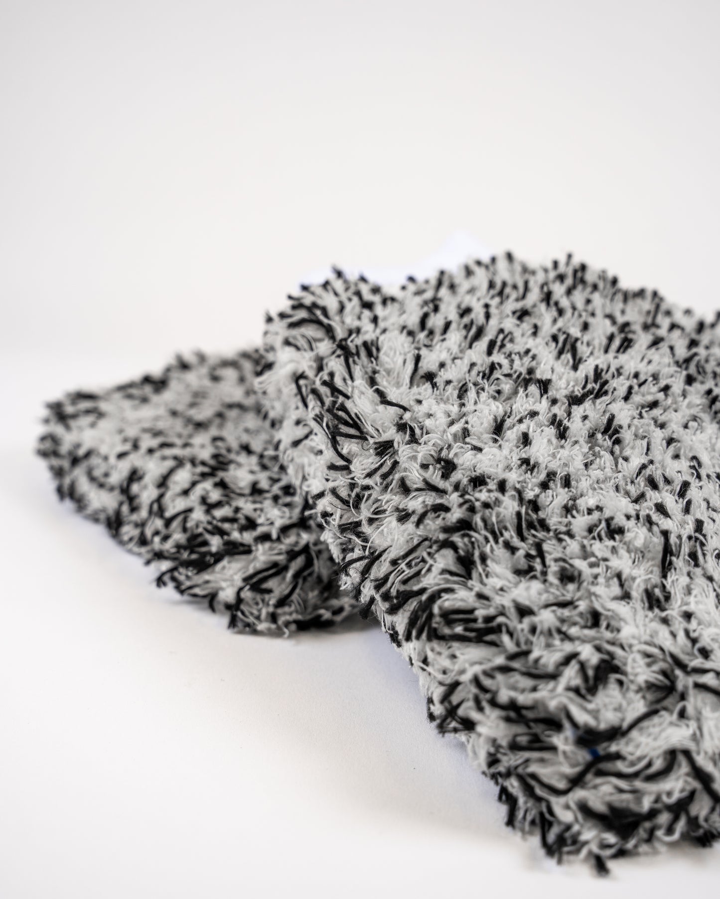 Close-up of the FibreKing Silver Label Korean Microfibre Wash Mitt in black, featuring premium Korean microfibre for gentle cleaning, shown on a white background.