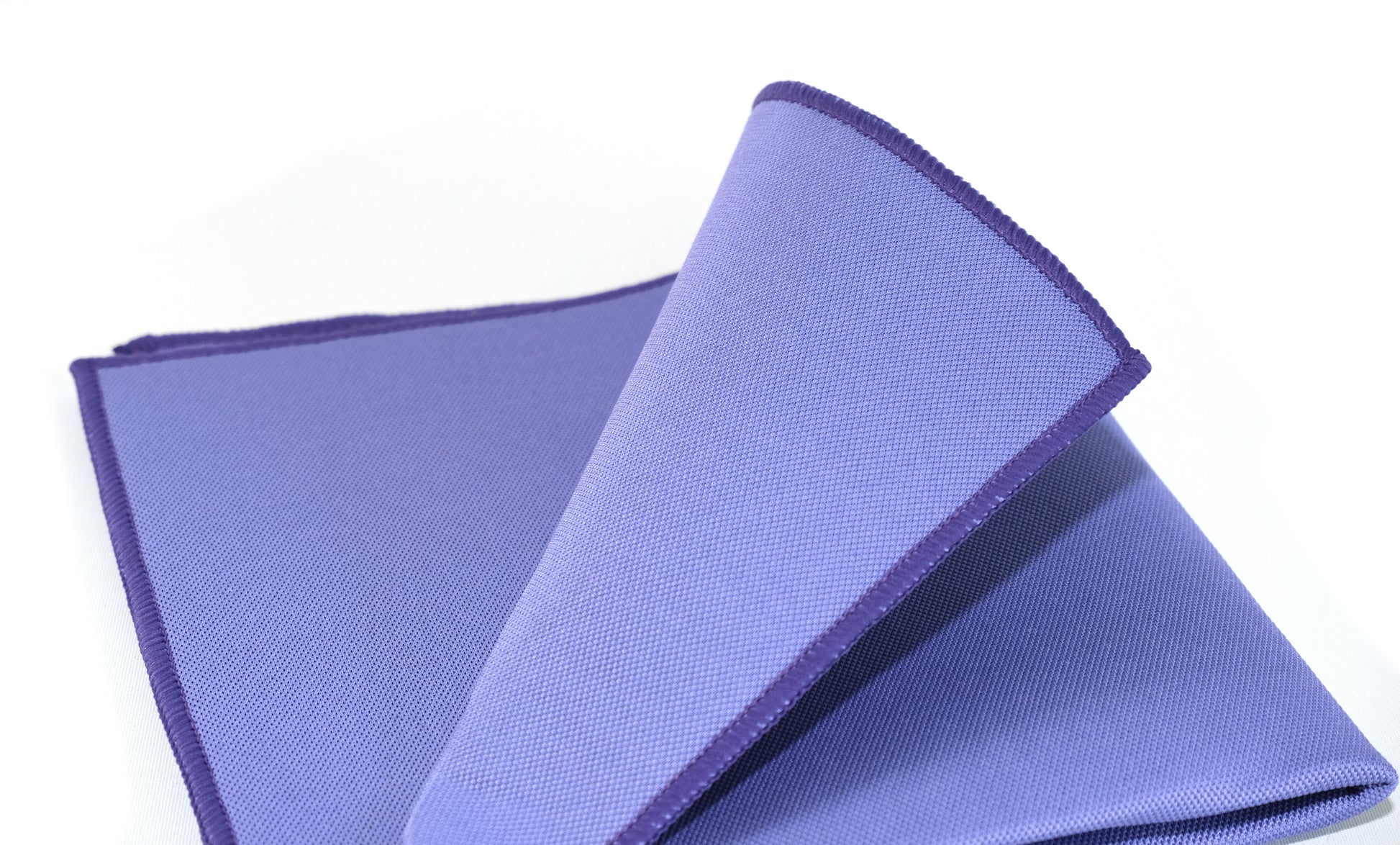 The FibreKing Gold Label Korean Glass Cloths - 3 Pack is shown neatly folded with dark purple edging on a white background, ideal for a streak-free finish.