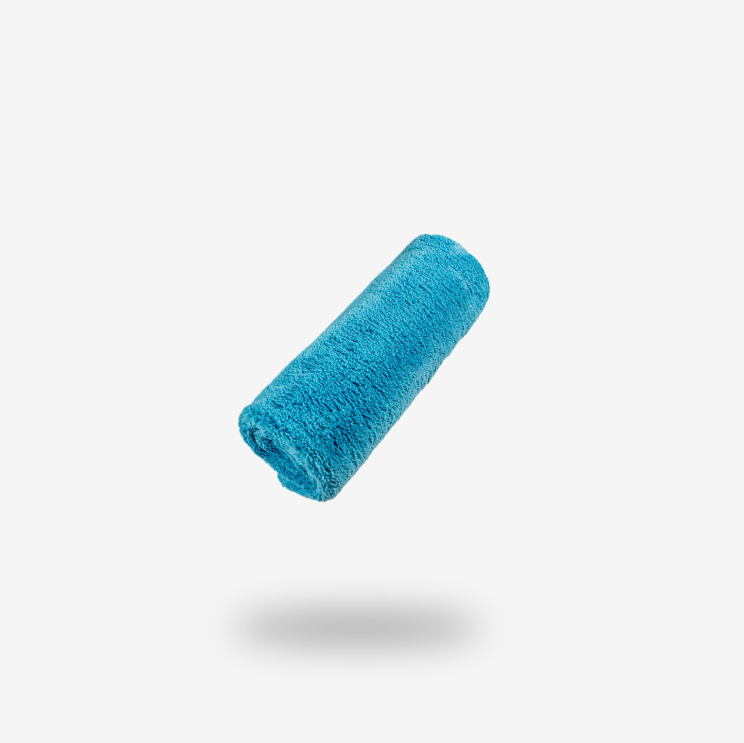 The FibreKing Ultimate Detailing Cloth, a blue coral fleece microfiber towel, floats above a white surface with a soft shadow below, highlighting its superior lint-free performance.