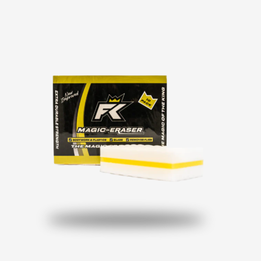 A rectangular FibreKing Magic Eraser (10 per pack) melamine cleaning sponge with a yellow stripe is placed in front of its black and yellow product box on a white background.