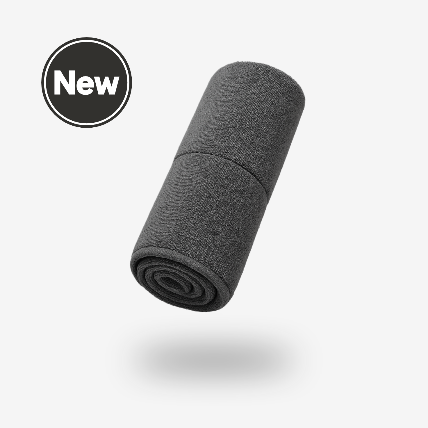 A rolled-up dark gray FibreKing Gold Label 900 GSM Korean Drying Towel floats above a white background with a New label in a black circle at the top left, highlighting its premium Korean microfiber for car care.