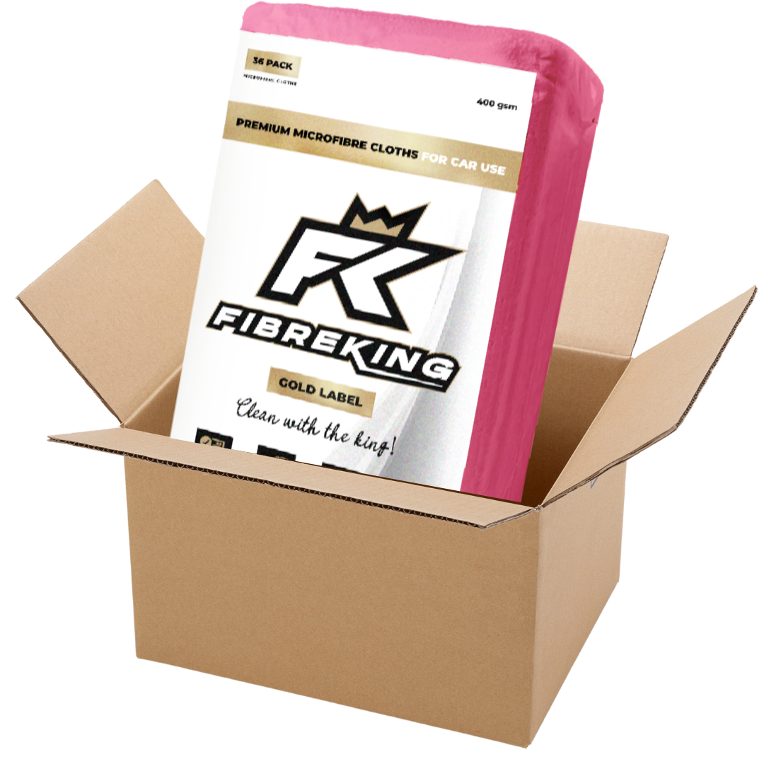 A partially opened box of FibreKing Gold Label 400GSM microfibre cloths (6 packs of 36), designed for cars, ultra-absorbent and soft with pink edges.