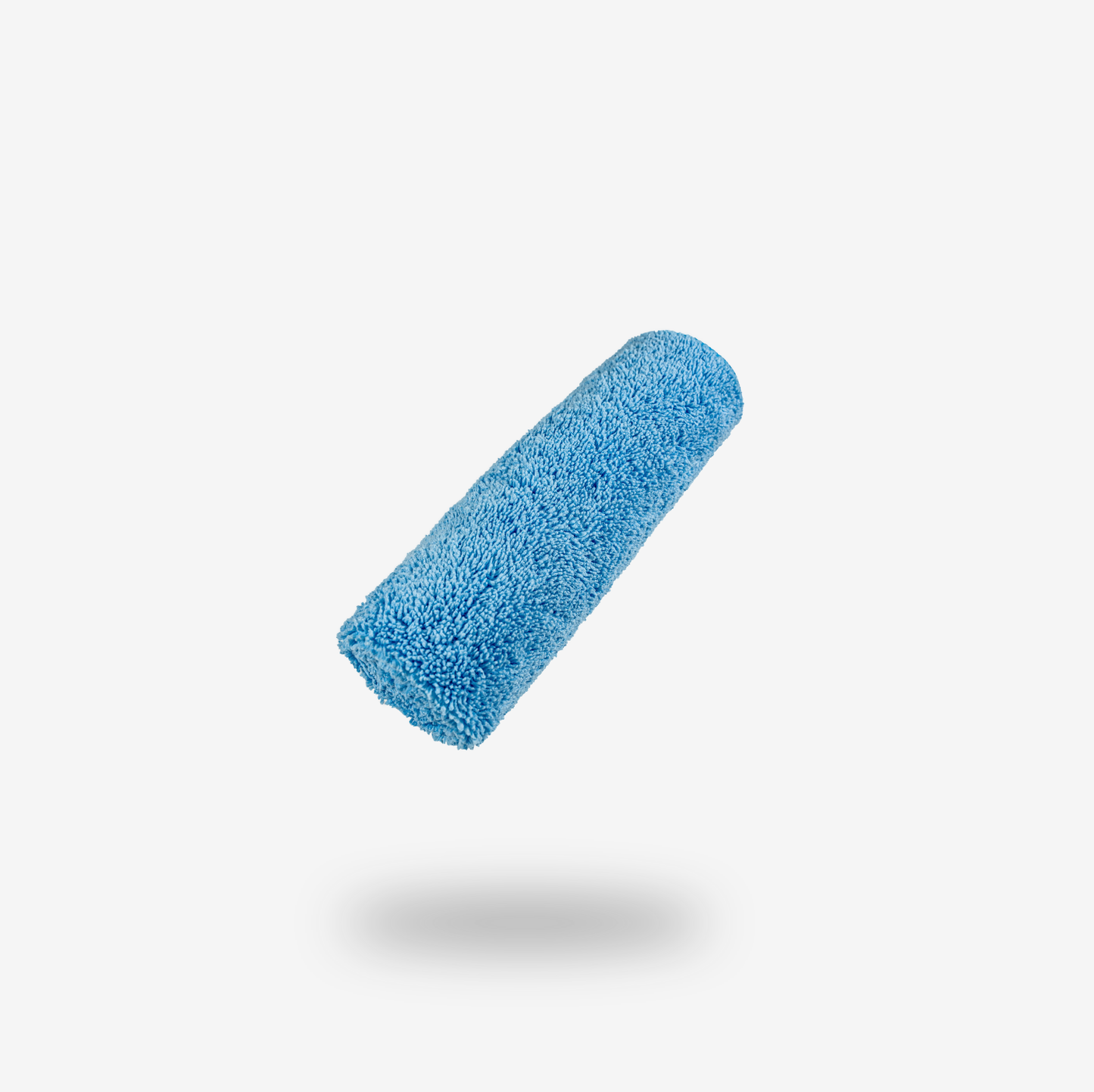 A blue microfiber paint roller cover is suspended against a plain white background with a soft shadow below, perfectly complementing your FibreKing Silver Label Microfibre Box for a streak-free, professional finish.