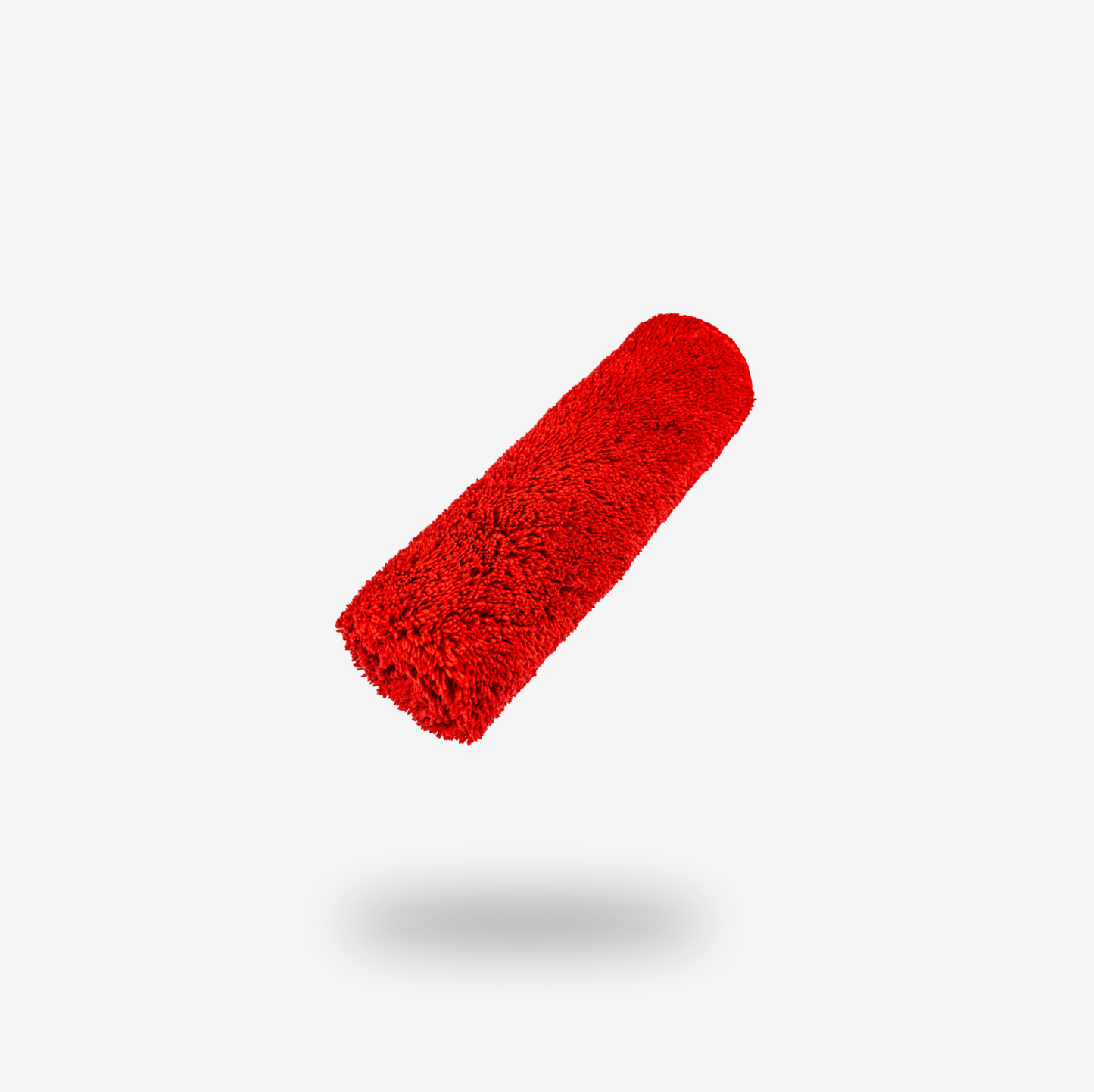 A red paint roller cover floats against a plain white background with a soft shadow beneath it, evoking the vibrant FibreKing Silver Label Microfibre Box often seen in clearance displays.