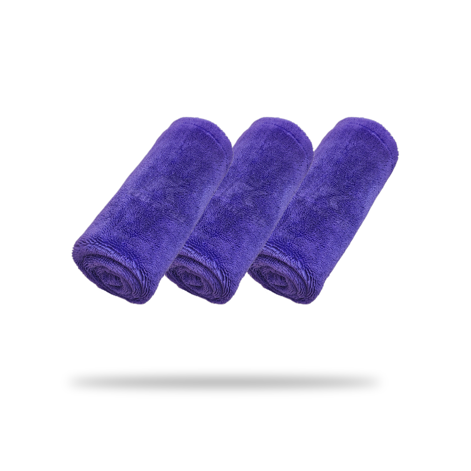 Three FibreKing Silver Label Drying Towels (3 Pack), in purple, are rolled and arranged in a row on a white background with a soft shadow.