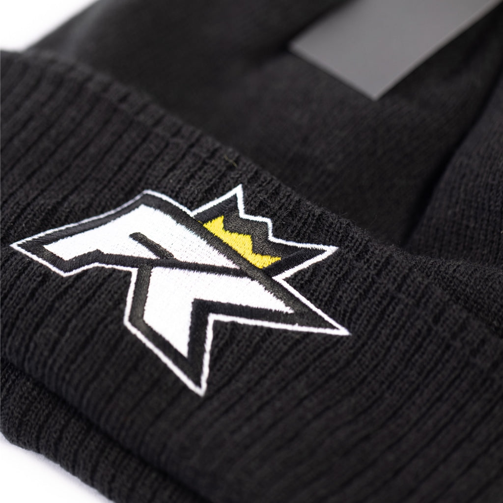 The FibreKing Beanie Hat by FibreKing is a black knit hat with a white and black stylized R logo plus a small yellow crown embroidered on the front, inspired by the classic FibreKing bobble hat style.