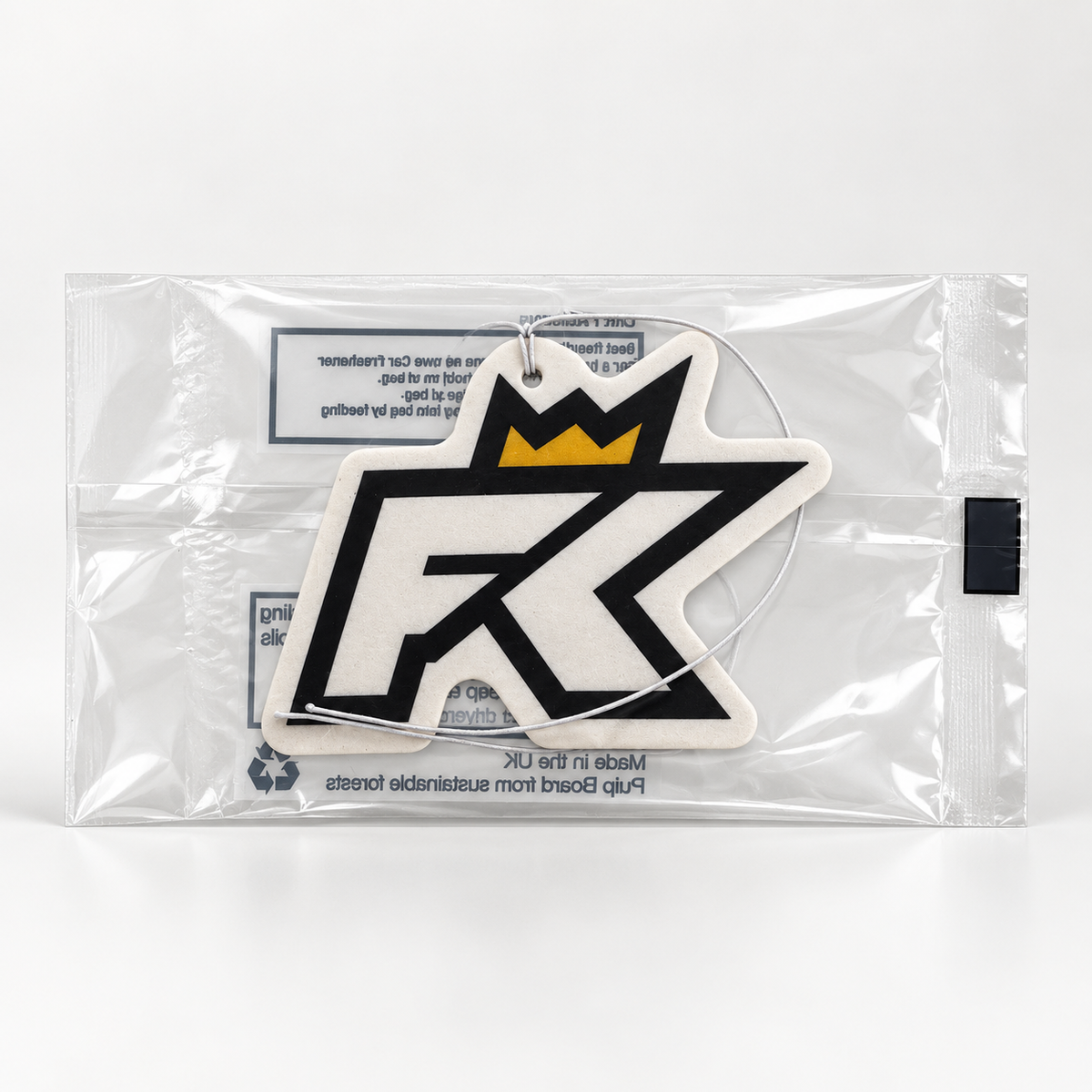 The FibreKing FK Air Freshener, featuring a black and white design with a prominent FK logo and a yellow crown, comes sealed in clear plastic packaging.