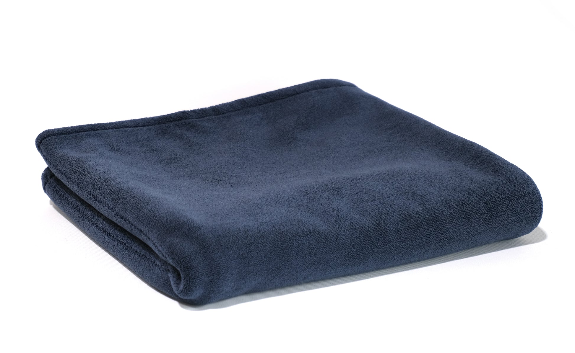 A neatly folded FibreKing Gold Label 900 GSM Korean Drying Towel, crafted from premium microfiber for car care, displayed on a white background.