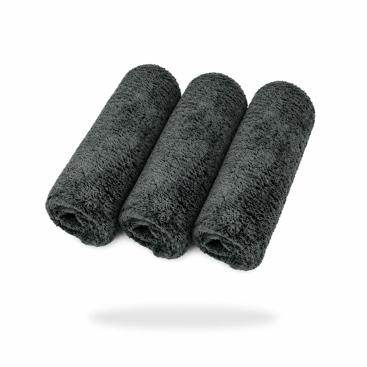 Three FibreKing Ultimate detailer cloths (3 pack) in dark gray microfibre are rolled side by side on a white background, with a soft shadow below.