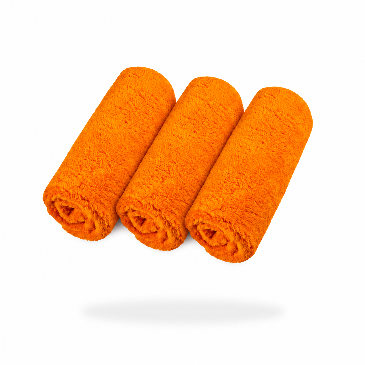 Three FibreKing Ultimate detailer cloths (3 pack) in orange are rolled and arranged side by side on a white background.