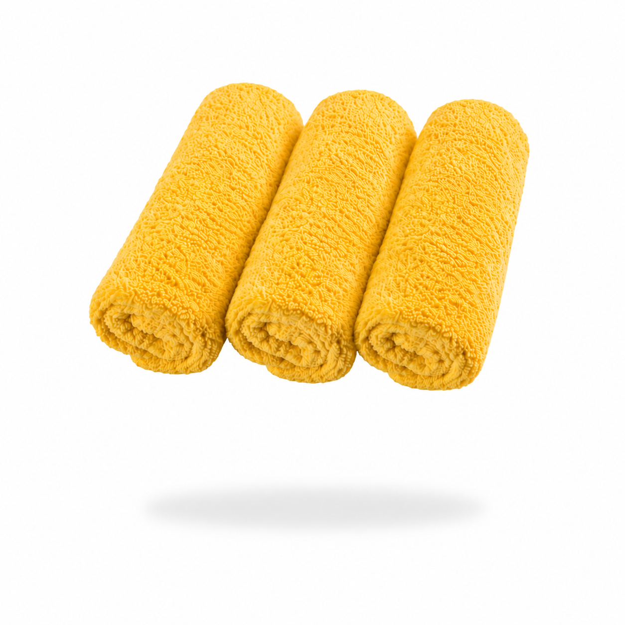 Three FibreKing Ultimate detailer cloths (3 pack) in yellow microfibre are rolled side by side on a white background with a soft shadow underneath.