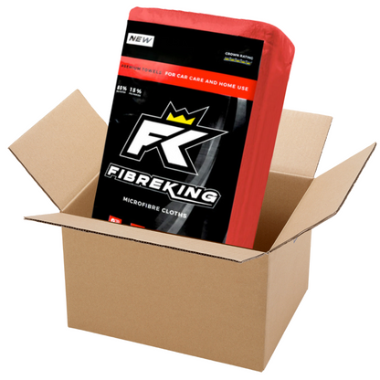 A box of FibreKing Silver Label 325GSM microfibre cloths (10 packs of 36) is partially out of an open brown cardboard box; these reusable, machine washable cloths are perfect for vehicle cleaning.