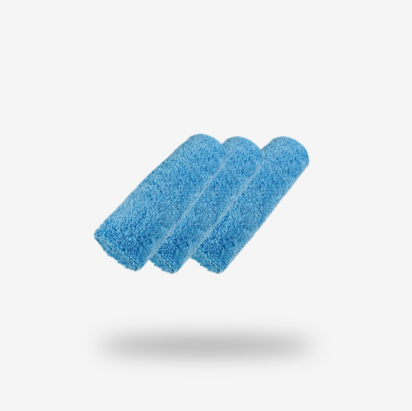 Three FibreKing Duplex edgeless cloths in baby blue, arranged side by side on a white background with faint shadows, highlighting their smooth, flawless finish—perfect for detailing. Available as a 3 pack.