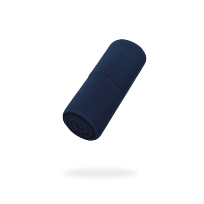 A FibreKing Gold Label 900 GSM Korean Drying Towel from a 3 Pack, rolled and dark blue, is suspended above a white background with a faint shadow below.