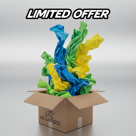 A cardboard box labeled FibreKing with vibrant blue, green, and yellow Silver Label Microfibre Bundle cloths spilling out—LIMITED OFFER: snag this clearance deal while it lasts!.