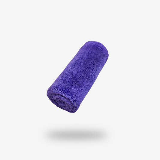 A rolled-up FibreKing Silver Label Drying Towel is shown against a plain white background with a shadow beneath it.